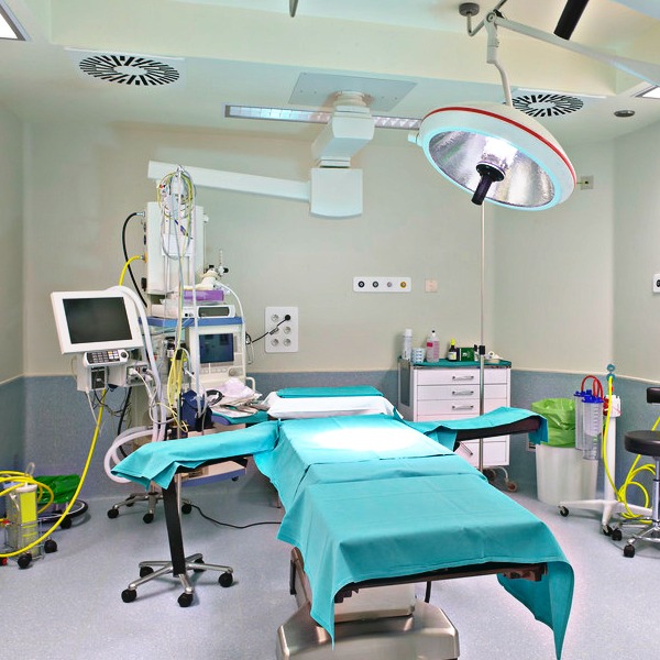 Modern hospital operating room with medical equipment.